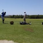 green grass with the flag in the hole.