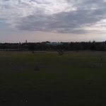 Panoramic view of a lush green golf course at Ball Golf Center. Smooth