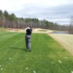 green grass with the flag in the hole.