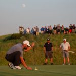 green grass with the flag in the hole.