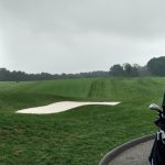 green grass with the flag in the hole.