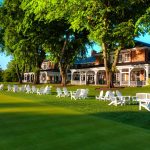 Panoramic view of a lush green golf course at Baltimore Country Club. Smooth