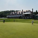 green grass with the flag in the hole.