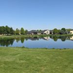 Panoramic view of a lush green golf course at BanBury Golf Course Eagle. Smooth