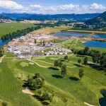 Panoramic view of a lush green golf course at Bar Run Golf & RV Resort. Smooth