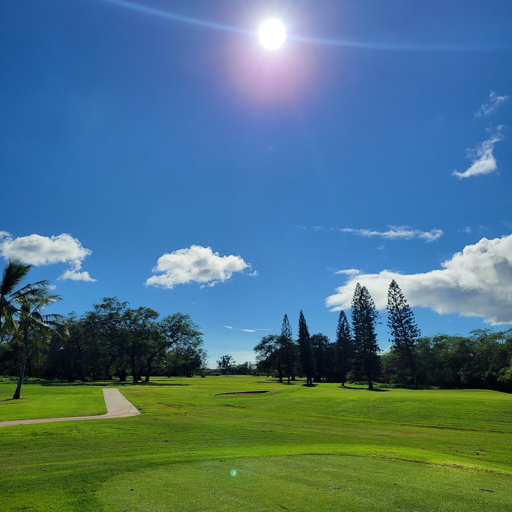 Panoramic view of a lush green golf course at Barbers Point Golf Course. Smooth