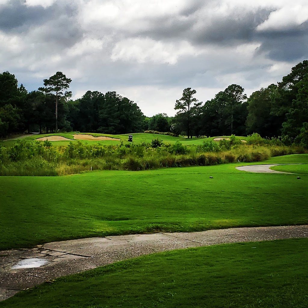 Panoramic view of a lush green golf course at Barefoot - Love Golf Course. Smooth
