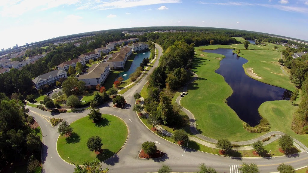 Panoramic view of a lush green golf course at Barefoot Resort & Golf. Smooth