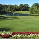 Panoramic view of a lush green golf course at Bartlett Hills Golf Club. Smooth
