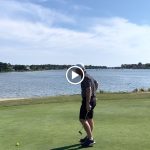 green grass with the flag in the hole.