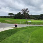 Panoramic view of a lush green golf course at Bass River Golf Course. Smooth