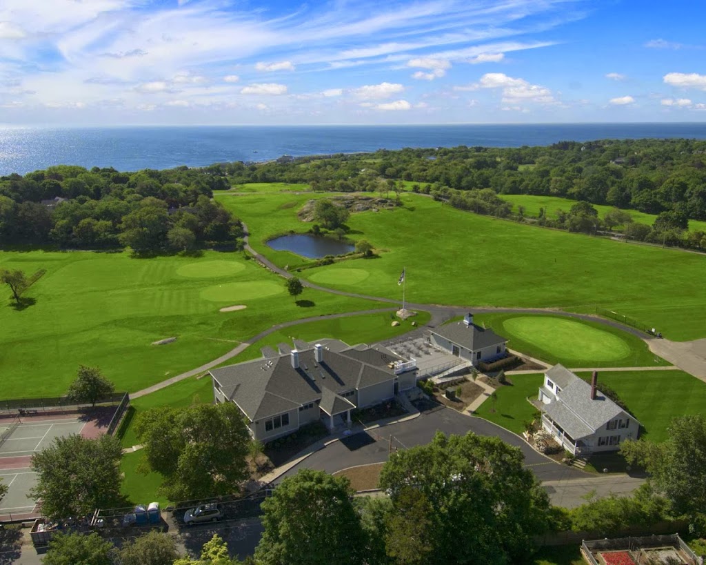 Panoramic view of a lush green golf course at Bass Rocks Golf Club. Smooth