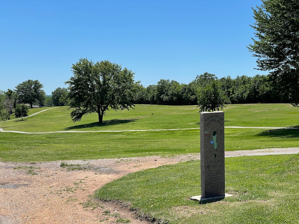 Panoramic view of a lush green golf course at Baxter Springs Golf & Country Club. Smooth