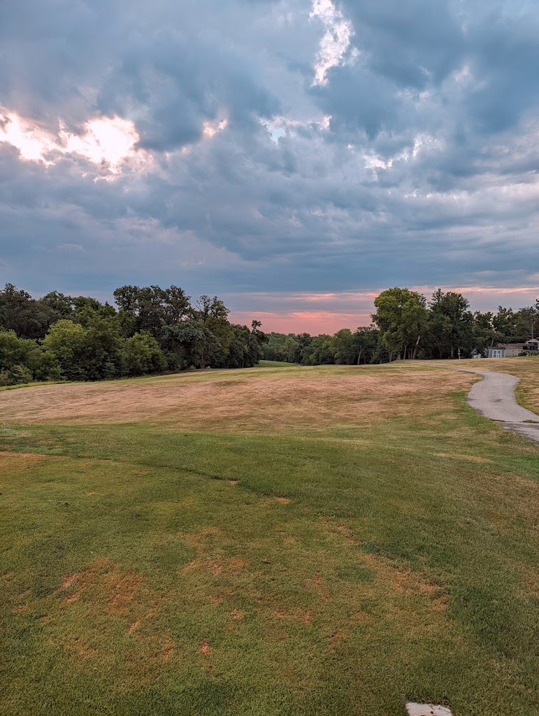 Panoramic view of a lush green golf course at Bay Hills Golf Club. Smooth
