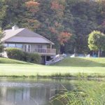 Panoramic view of a lush green golf course at Bay Meadows Family Golf Course. Smooth