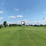 green grass with the flag in the hole.