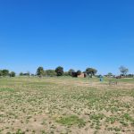 Panoramic view of a lush green golf course at Bay Park Golf Course. Smooth