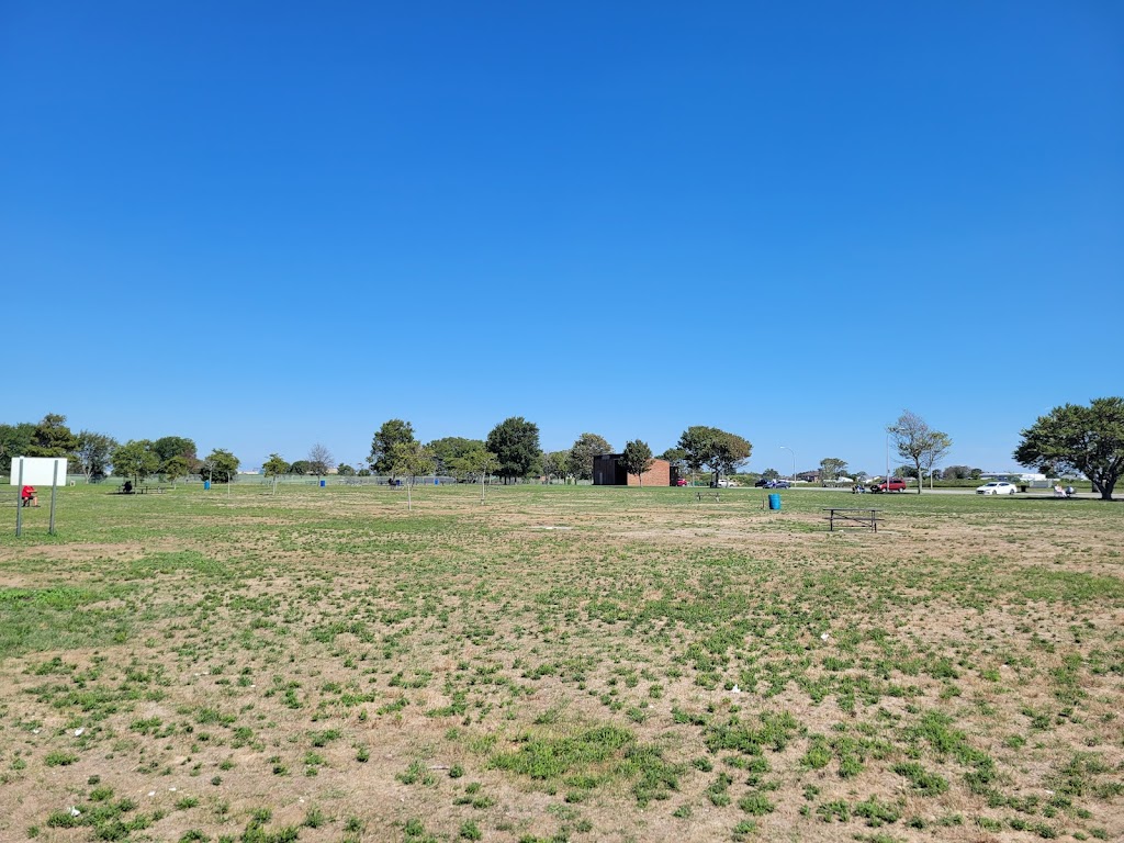 Panoramic view of a lush green golf course at Bay Park Golf Course. Smooth