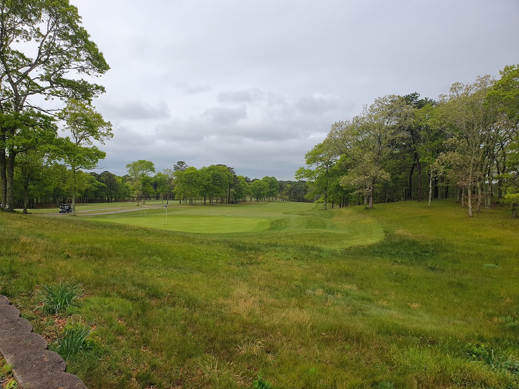 Panoramic view of a lush green golf course at Bayberry Hills Golf Course. Smooth