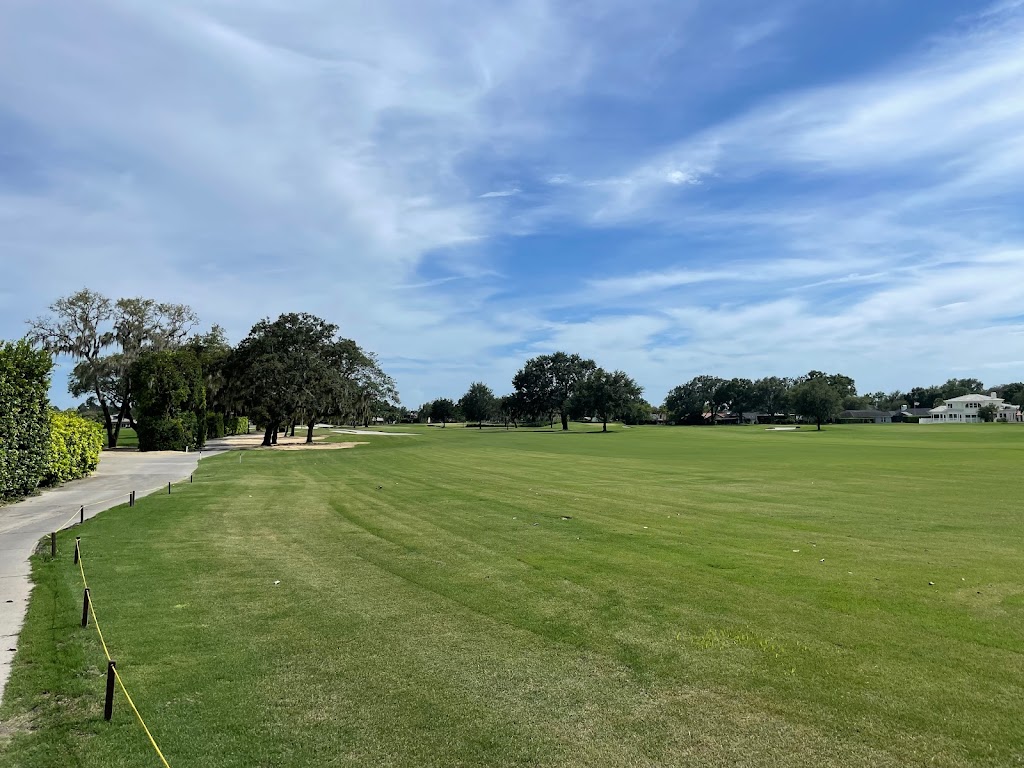 Panoramic view of a lush green golf course at Bayhill CC. Smooth