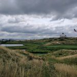 green grass with the flag in the hole.