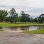 Panoramic view of a lush green golf course at Bayou Bend Golf &Health Club. Smooth