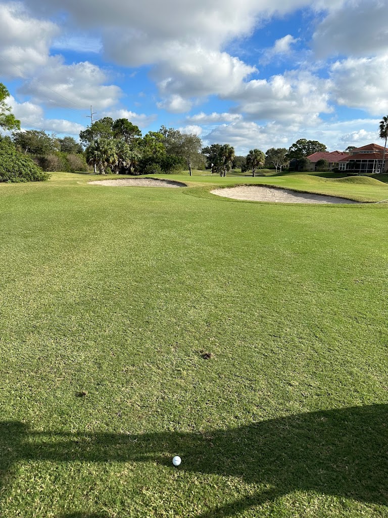 Panoramic view of a lush green golf course at Bayou Club. Smooth