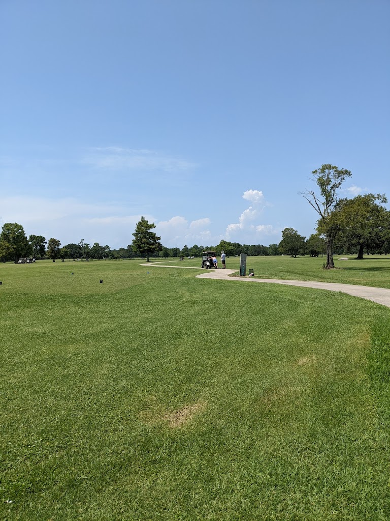Panoramic view of a lush green golf course at Bayou Oaks At City Park. Smooth