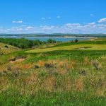Panoramic view of a lush green golf course at Bayside Golf. Smooth