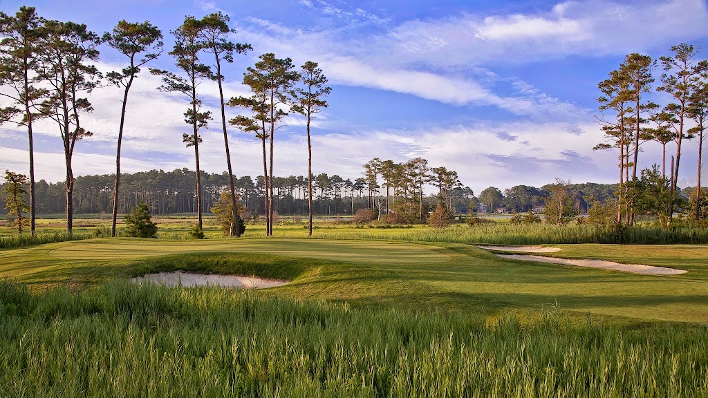 Panoramic view of a lush green golf course at Bayside Resort Golf Club. Smooth