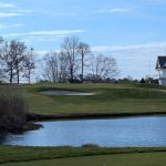green grass with the flag in the hole.