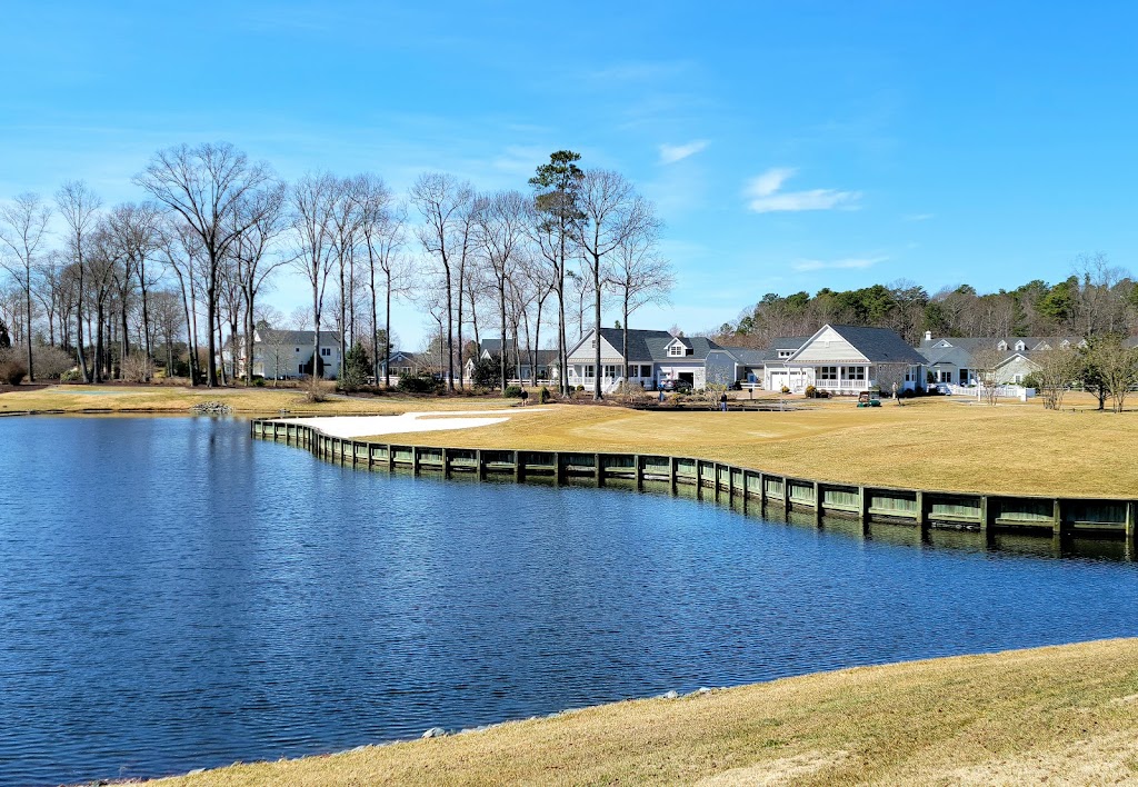 Panoramic view of a lush green golf course at Baywood Greens Golf Course and Clubhouse. Smooth