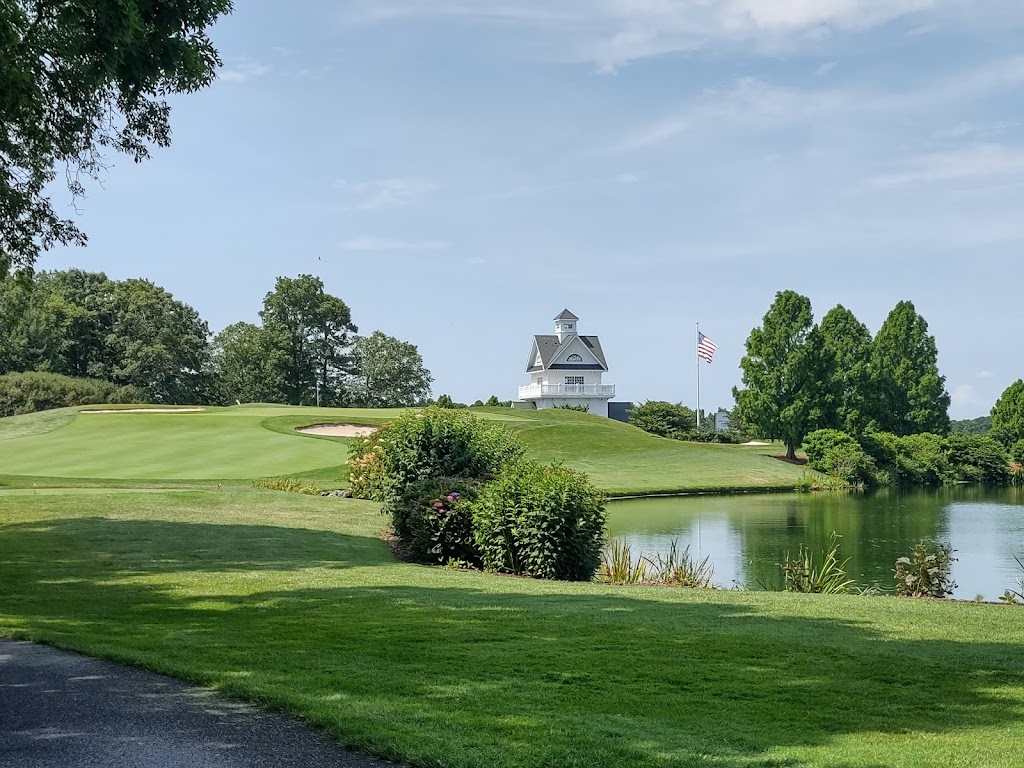 Panoramic view of a lush green golf course at Baywood Greens. Smooth
