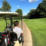 green grass with the flag in the hole.