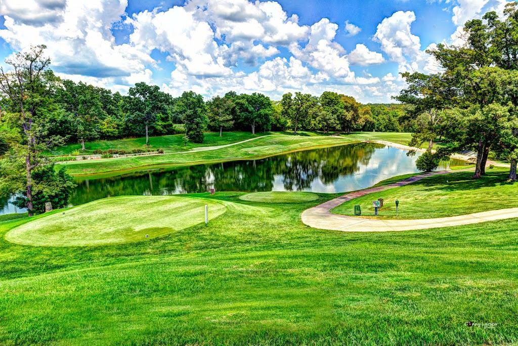 Panoramic view of a lush green golf course at Bear Creek Valley Golf Club. Smooth