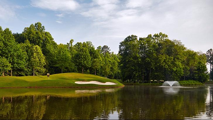 Panoramic view of a lush green golf course at Bear's Best Atlanta. Smooth