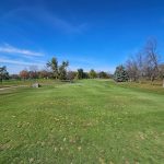 Panoramic view of a lush green golf course at Beaver Creek Golf Club. Smooth