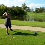 green grass with the flag in the hole.