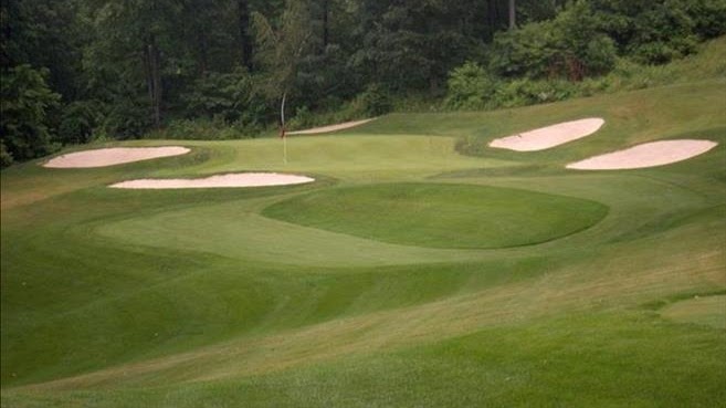Panoramic view of a lush green golf course at Beekman Golf Course. Smooth