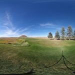 green grass with the flag in the hole.