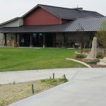 Panoramic view of a lush green golf course at Bell Nob Golf Course. Smooth