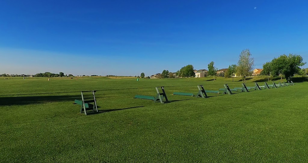 Panoramic view of a lush green golf course at Bella Rosa Golf Course. Smooth