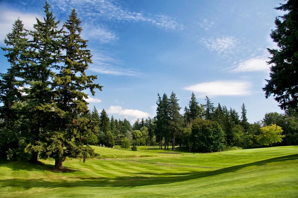 Panoramic view of a lush green golf course at Bellingham Golf and Country Club. Smooth