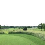 Panoramic view of a lush green golf course at Belmar Golf Club. Smooth