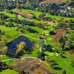 Panoramic view of a lush green golf course at Belmont Golf Club. Smooth