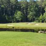 Panoramic view of a lush green golf course at Belmont Lake Golf Club. Smooth
