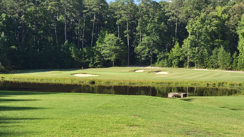 Panoramic view of a lush green golf course at Belmont Lake Golf Club. Smooth