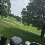 green grass with the flag in the hole.