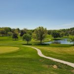 Panoramic view of a lush green golf course at Benson Championship Golf Course. Smooth
