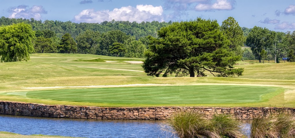 Panoramic view of a lush green golf course at Bent Brook. Smooth